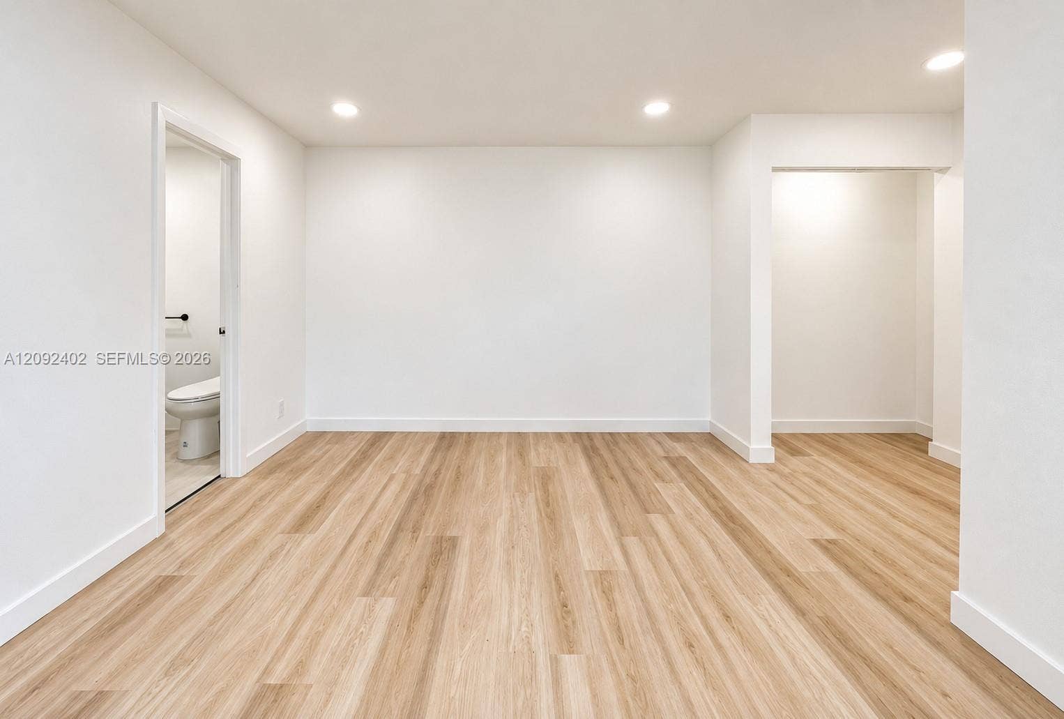 499 SE 13th Street, #7E, Fort Lauderdale, FL 33316 Interior space featuring wood-finish flooring, recessed lighting, and neutral wall paint