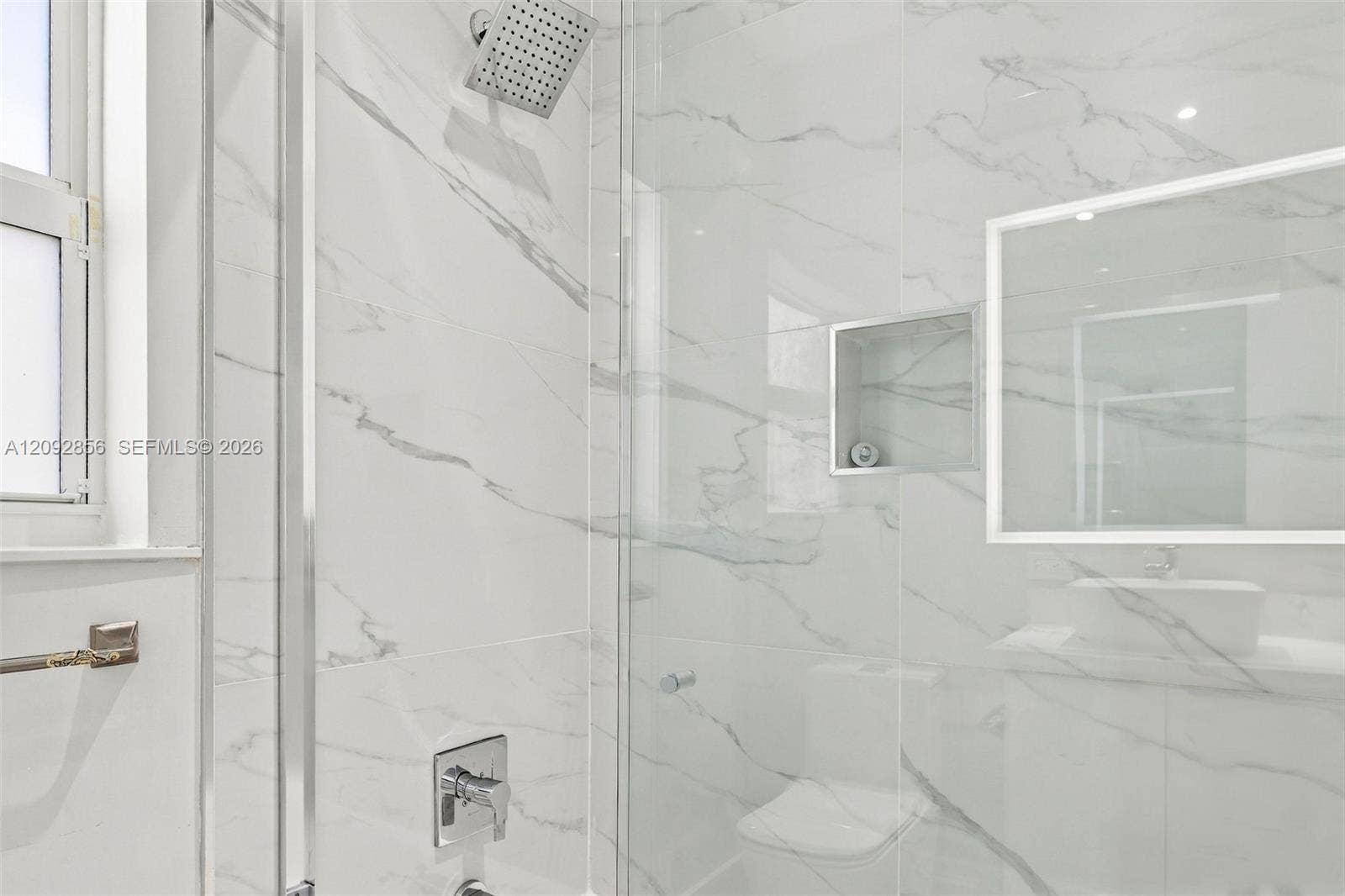 18919 SW 24th Street, #18919, Miramar, Miramar, FL 33029 3rd bathroom - 2nd floor - Full-height large-format wall tiling, glass-enclosed shower, built-in recessed storage niche, square rainfall showerhead, and chrome fixtures