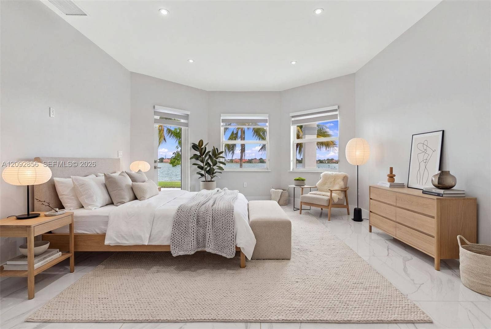 18919 SW 24th Street, #18919, Miramar, Miramar, FL 33029 Virtually staged - Spacious bedroom featuring large-format stone flooring, recessed lighting, and a bay window configuration providing exterior water access and scenery