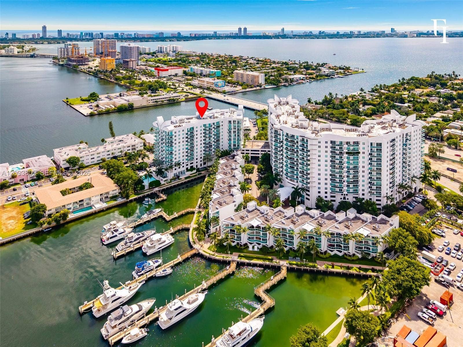 7910 Harbor Island Drive, #909, North Bay Village, North Bay Village, FL 33141 Waterfront high-rise building featuring private deep-water boat slips, expansive exterior balconies, and direct proximity to open coastal waters
