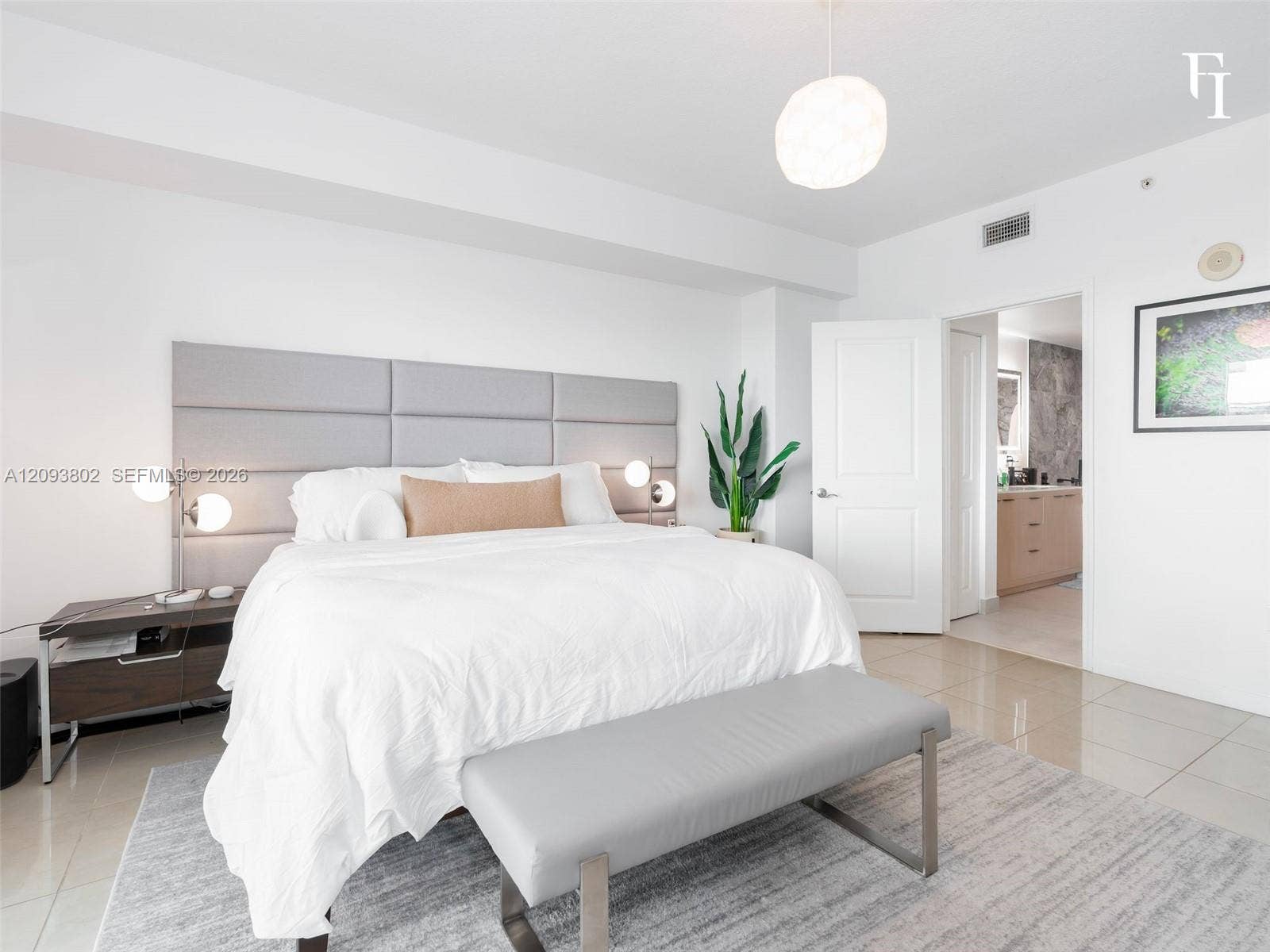 7910 Harbor Island Drive, #909, North Bay Village, North Bay Village, FL 33141 Large-format tile flooring, built-in panel headboard, and contemporary pendant lighting