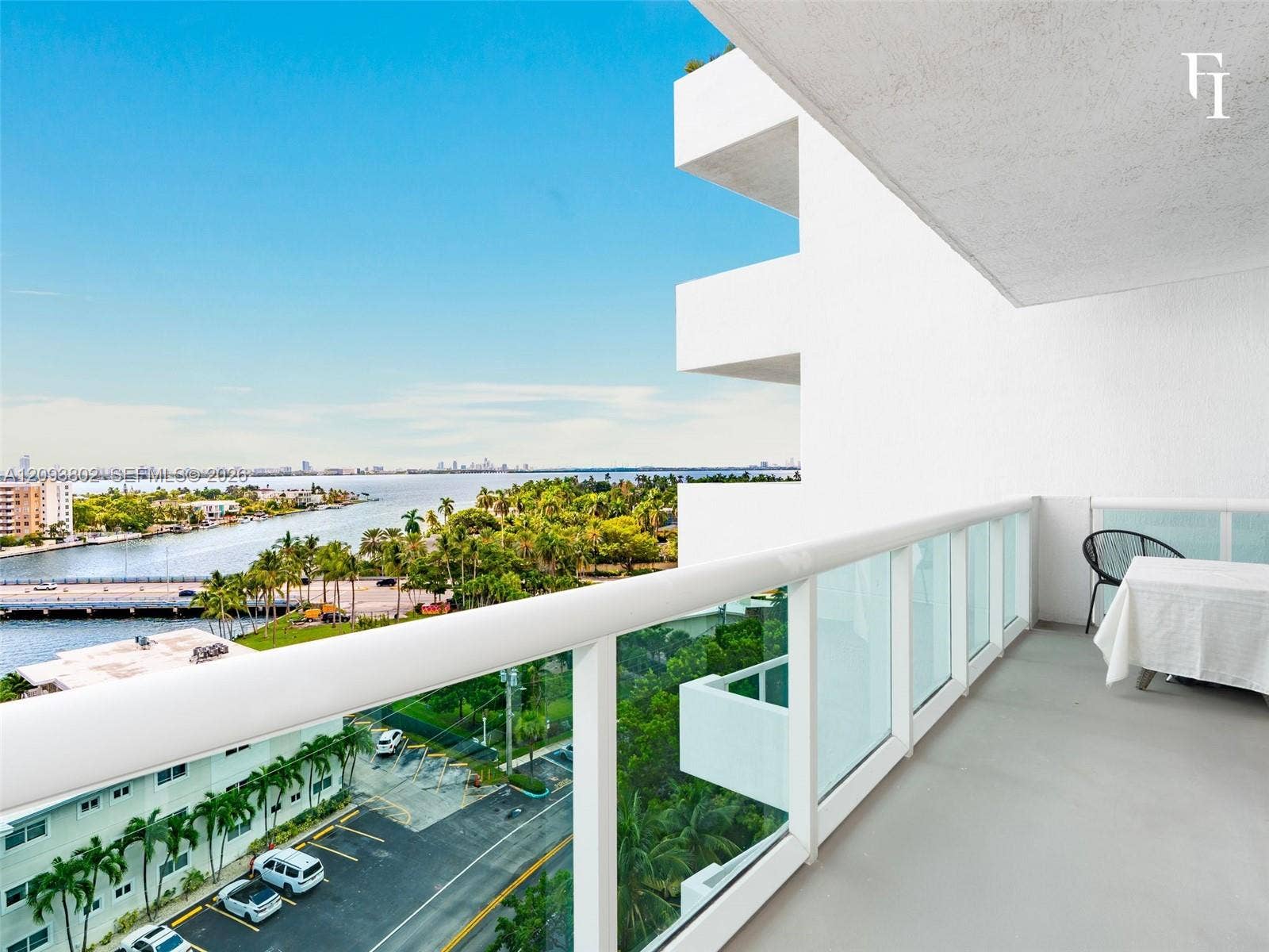 7910 Harbor Island Drive, #909, North Bay Village, North Bay Village, FL 33141 Private balcony featuring concrete flooring and a white glass-panel railing, offering a waterfront exposure