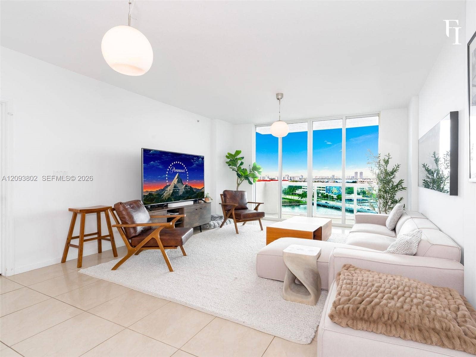 7910 Harbor Island Drive, #909, North Bay Village, North Bay Village, FL 33141 Living area featuring floor-to-ceiling windows, large-format tile flooring, and dual globe pendant lighting
