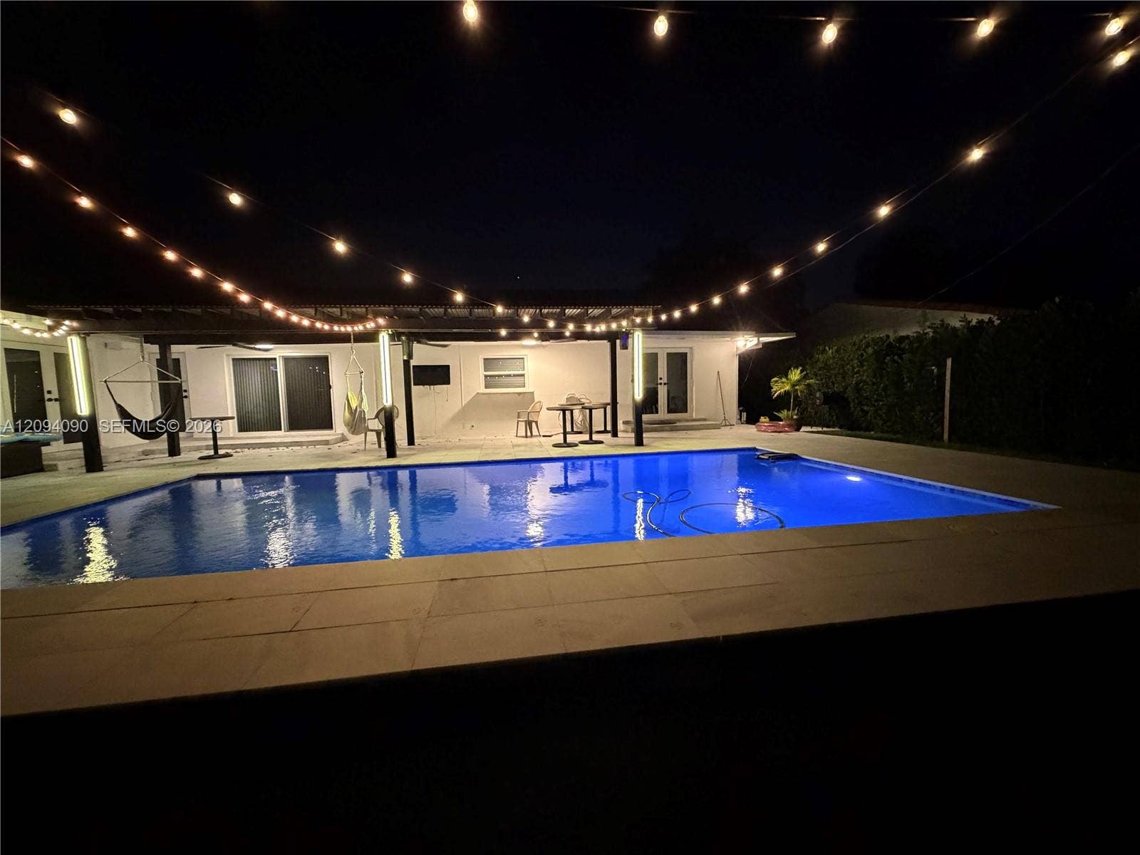 2215 NE 204th Street, Miami, FL 33180 Rectangular swimming pool with light-colored coping