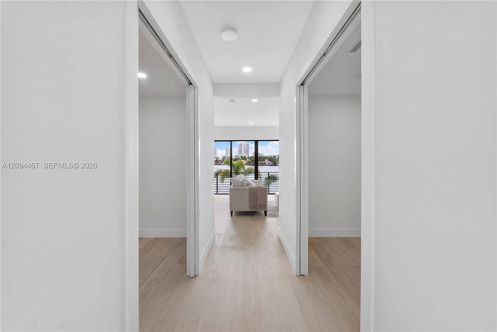 Second floor hallway and his & her closets on left and right