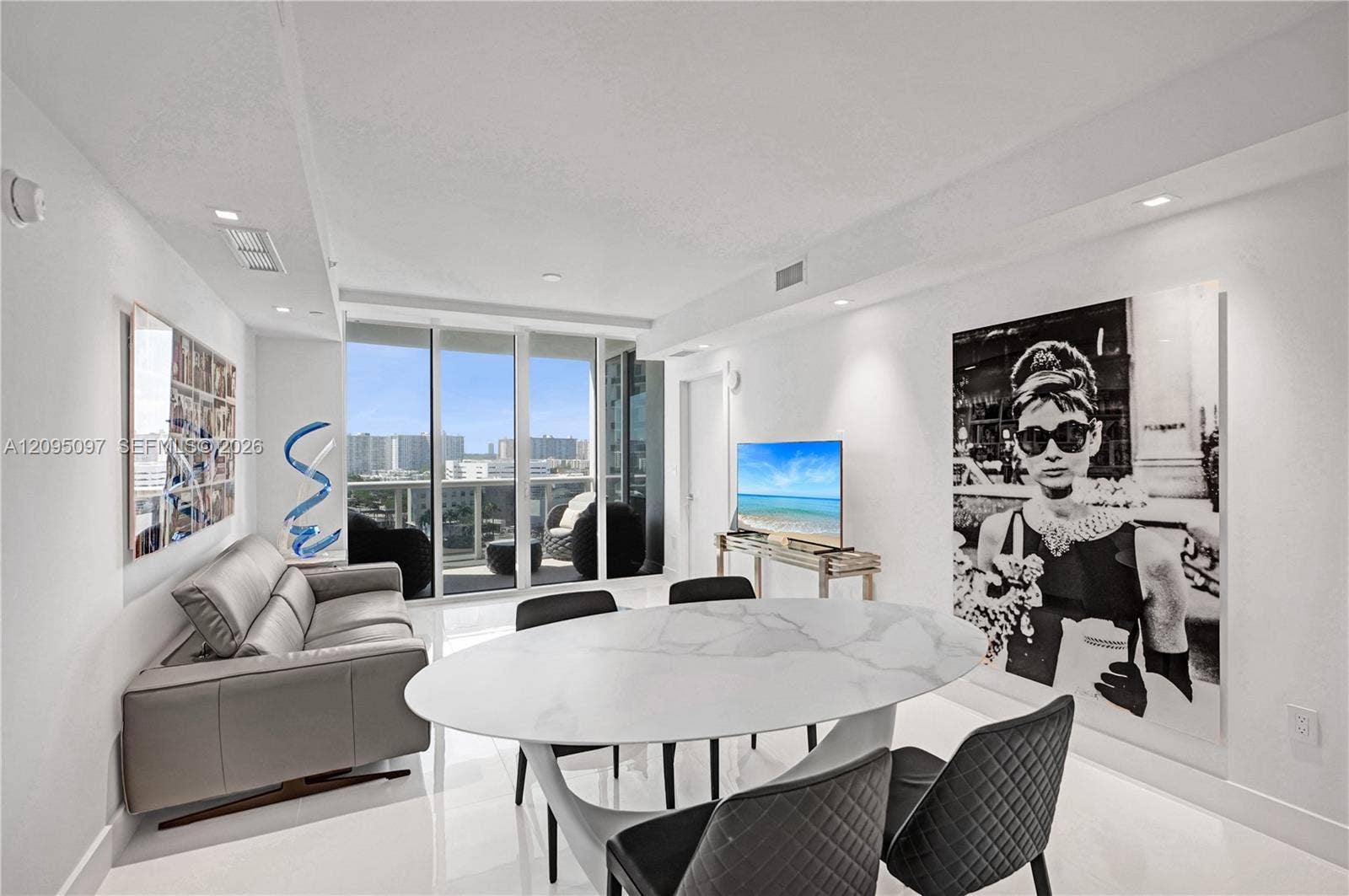 18201 Collins Avenue, #1407, Sunny Isles Beach, FL 33160 Floor-to-ceiling glass wall, polished tile flooring, recessed ceiling lighting, and private balcony access