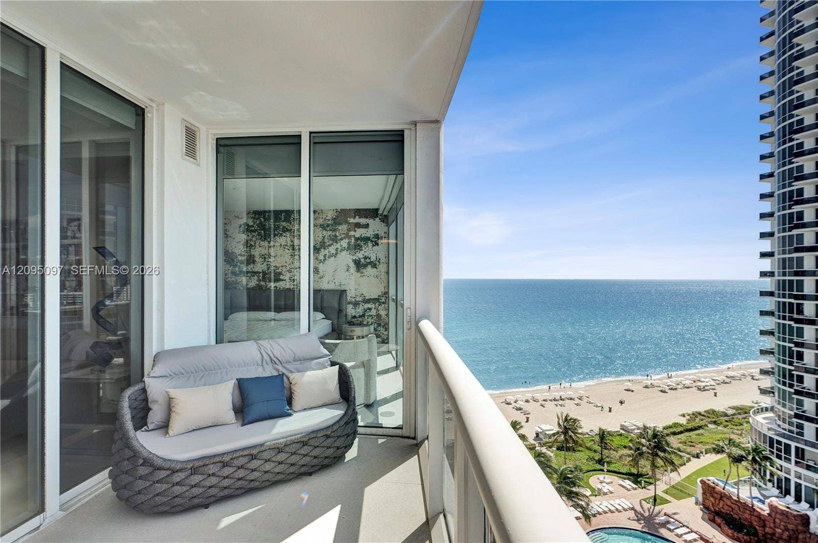18201 Collins Avenue, #1407, Sunny Isles Beach, FL 33160 Private balcony with full-height glass railing, floor-to-ceiling sliding glass doors, and panoramic oceanfront exposure