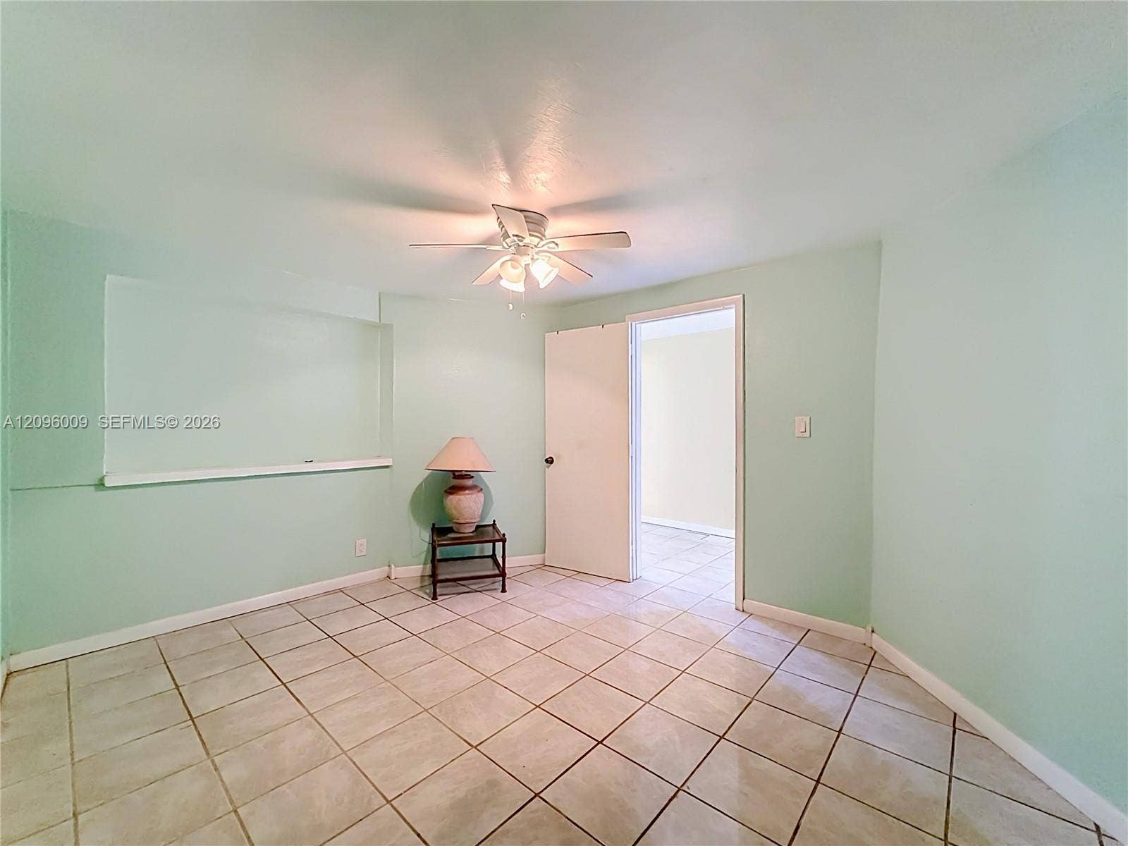 1191 Alabama Avenue, Fort Lauderdale, FL 33312 Neutral-toned tile flooring, recessed wall niche, and ceiling-mounted light fixture with fan