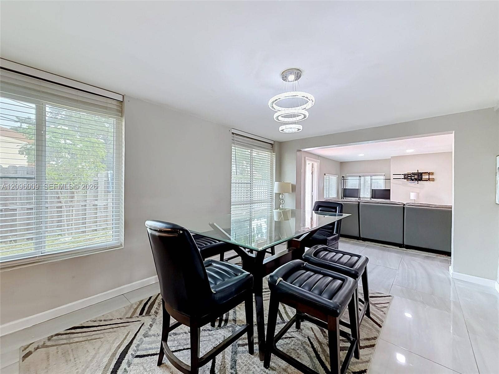 1191 Alabama Avenue, Fort Lauderdale, FL 33312 Large-format tile flooring, multi-tiered circular pendant lighting, and horizontal window blinds