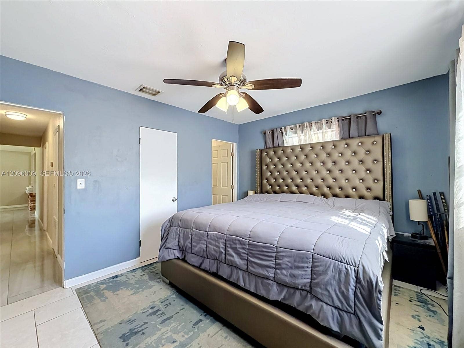 1191 Alabama Avenue, Fort Lauderdale, FL 33312 Room featuring ceramic tile flooring, neutral wall paint, and a multi-blade ceiling fan with integrated lighting