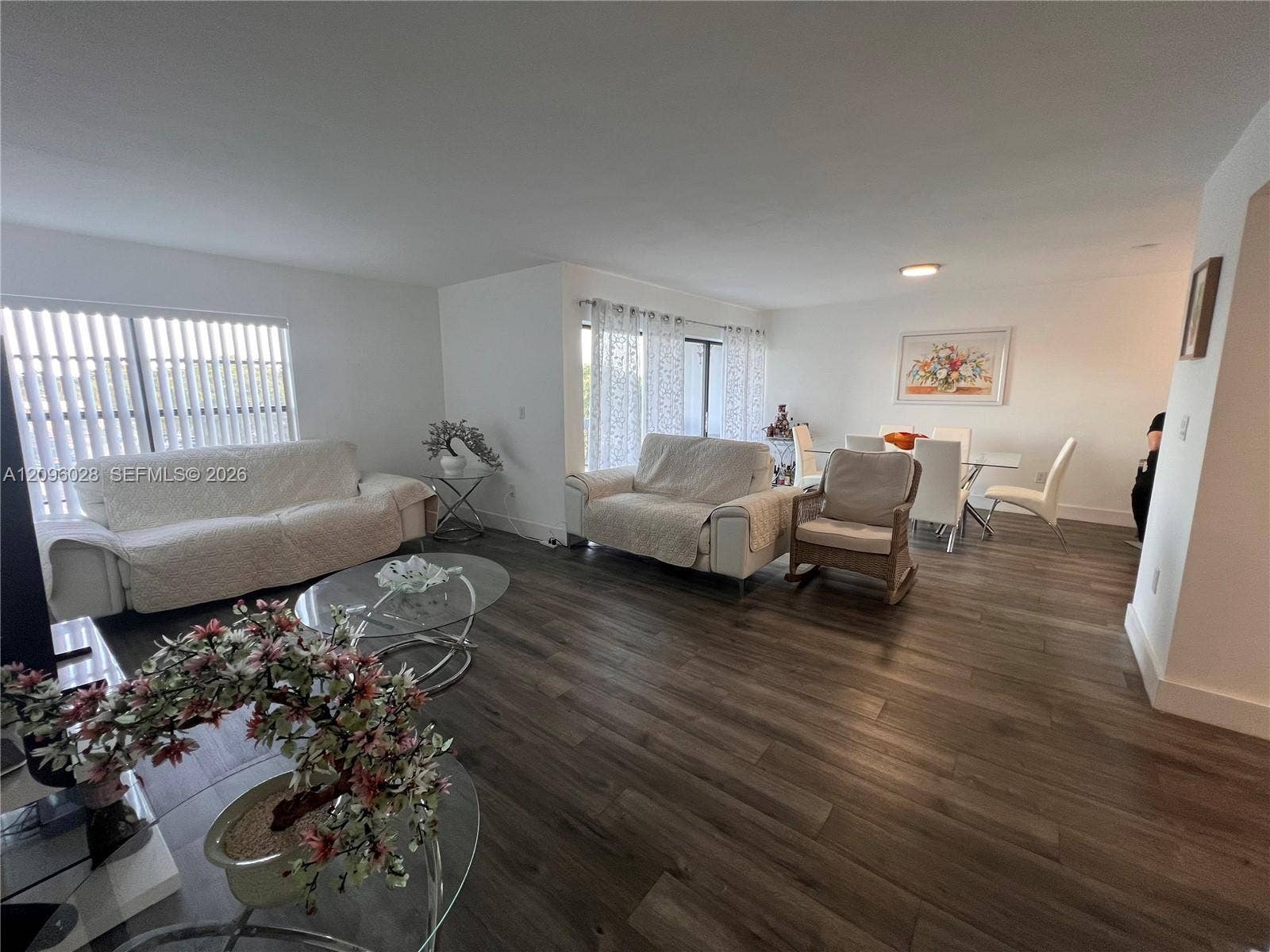 6300 SW 138th Court, #405, Miami, FL 33183 Open floor plan featuring wood-finish flooring, recessed lighting, and expansive windows
