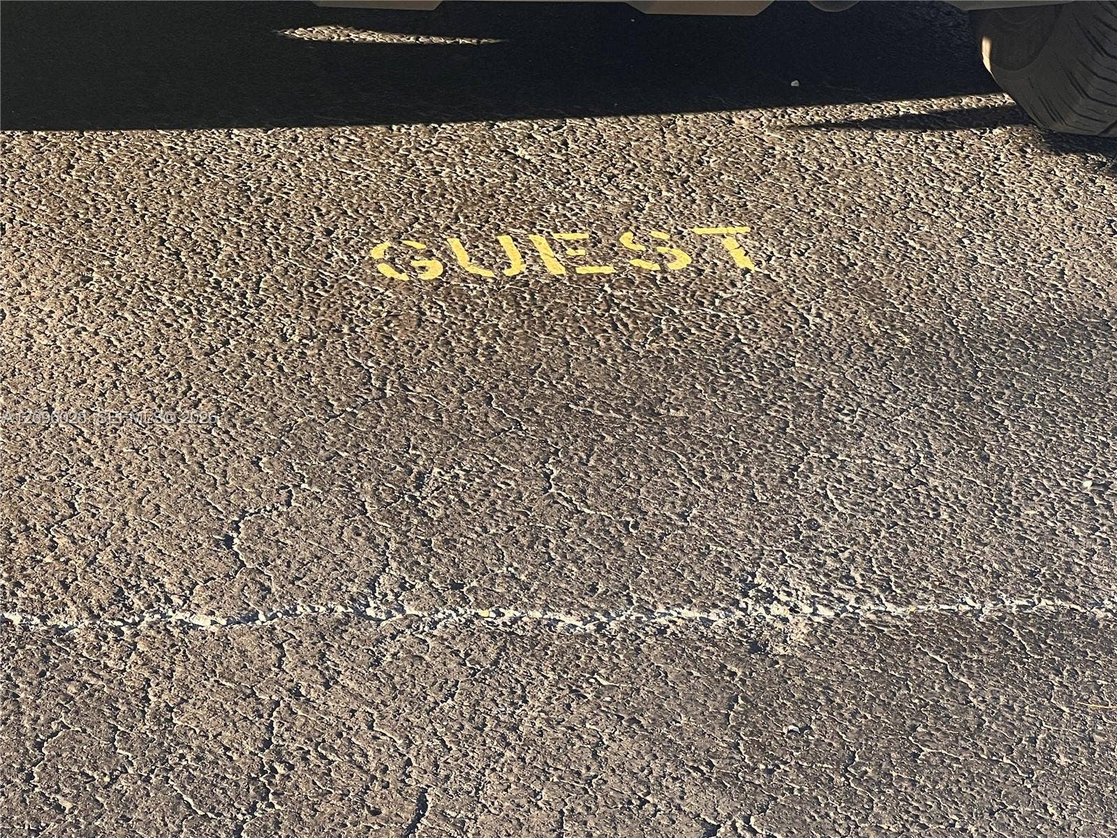 6300 SW 138th Court, #405, Miami, FL 33183 Asphalt parking surface with designated yellow-painted marking