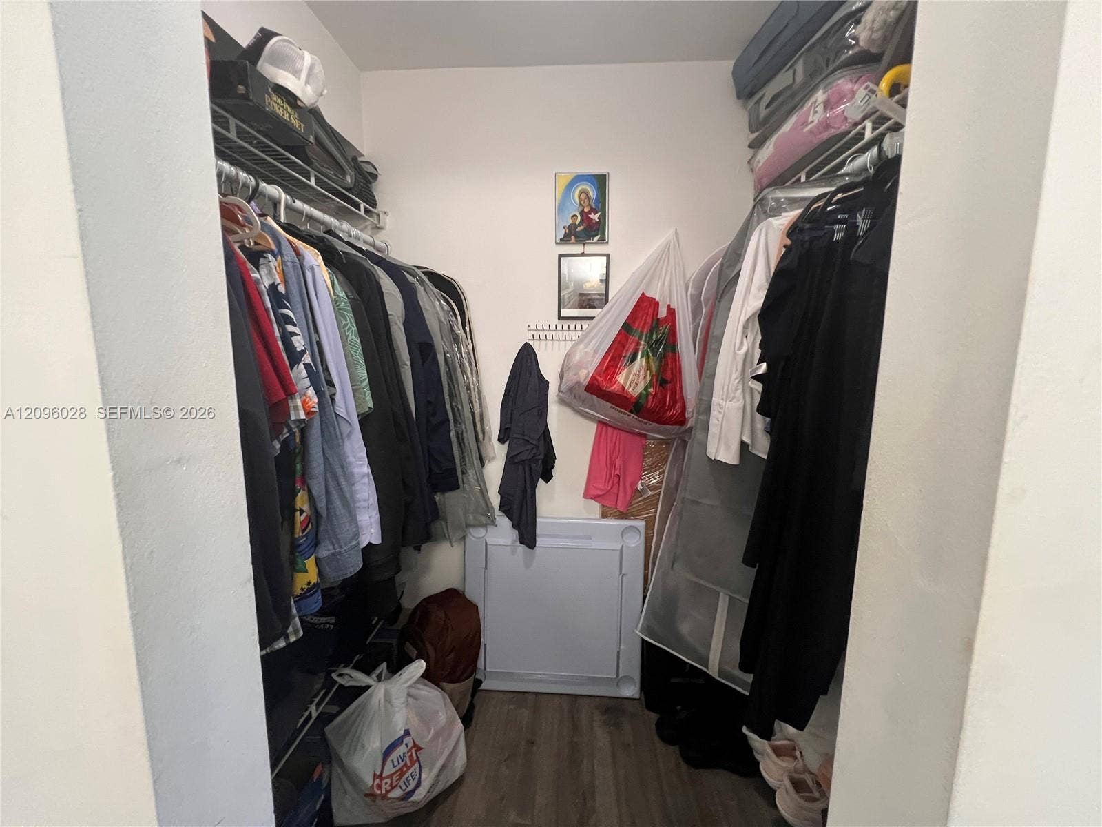 6300 SW 138th Court, #405, Miami, FL 33183 Walk-in closet featuring dual-level wire shelving and wood-finish flooring