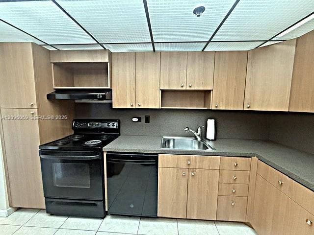 20355 NE 34th Court, #1925, Aventura, FL 33180 Kitchen featuring light-finish cabinetry, black appliances, textured countertops, stainless steel sink with metal faucet, and grid-pattern ceiling lighting