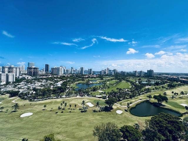 20355 NE 34th Court, #1925, Aventura, FL 33180 Panoramic landscape featuring a golf course, expansive greenery, water features, and a skyline backdrop