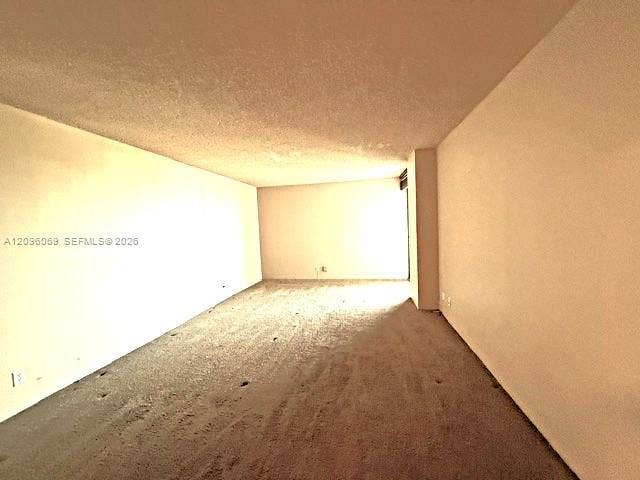 20355 NE 34th Court, #1925, Aventura, FL 33180 Expansive interior room featuring neutral wall finishes and wall-to-wall carpeting