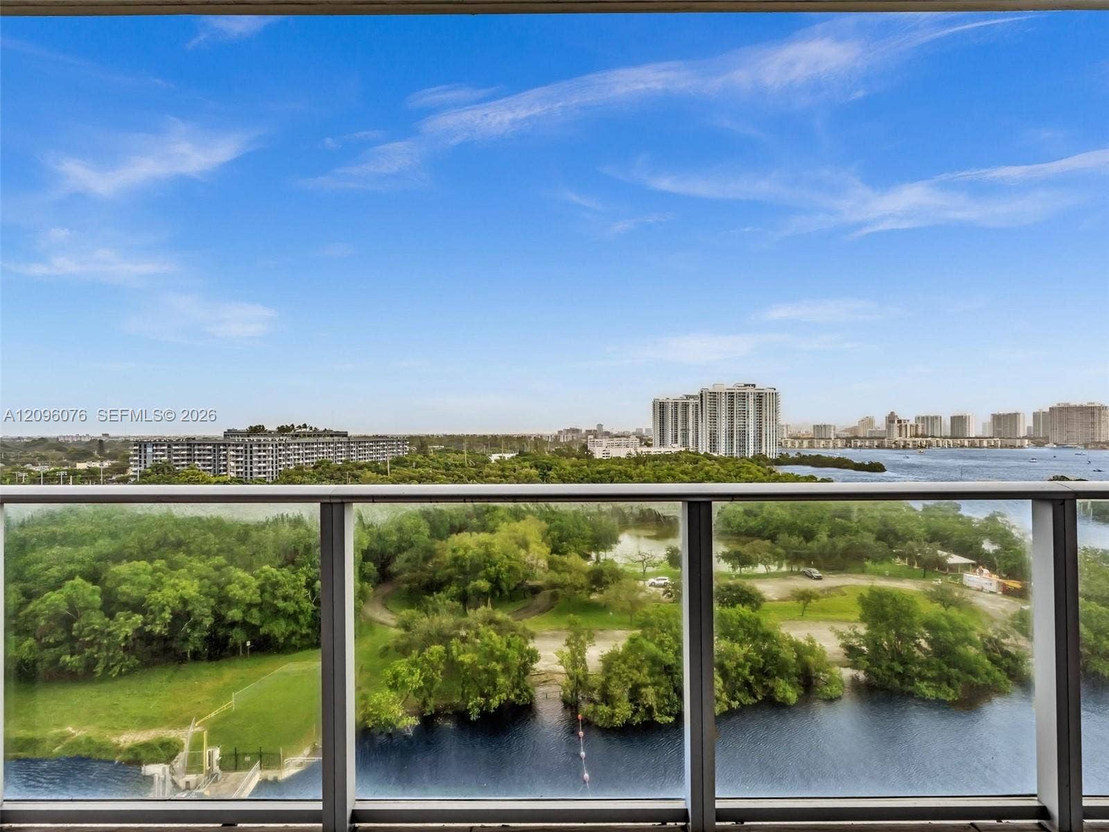16385 Biscayne Boulevard, #1101, North Miami Beach, FL 33160 Balcony featuring glass panel railing and panoramic landscape, waterway, and skyline scenery