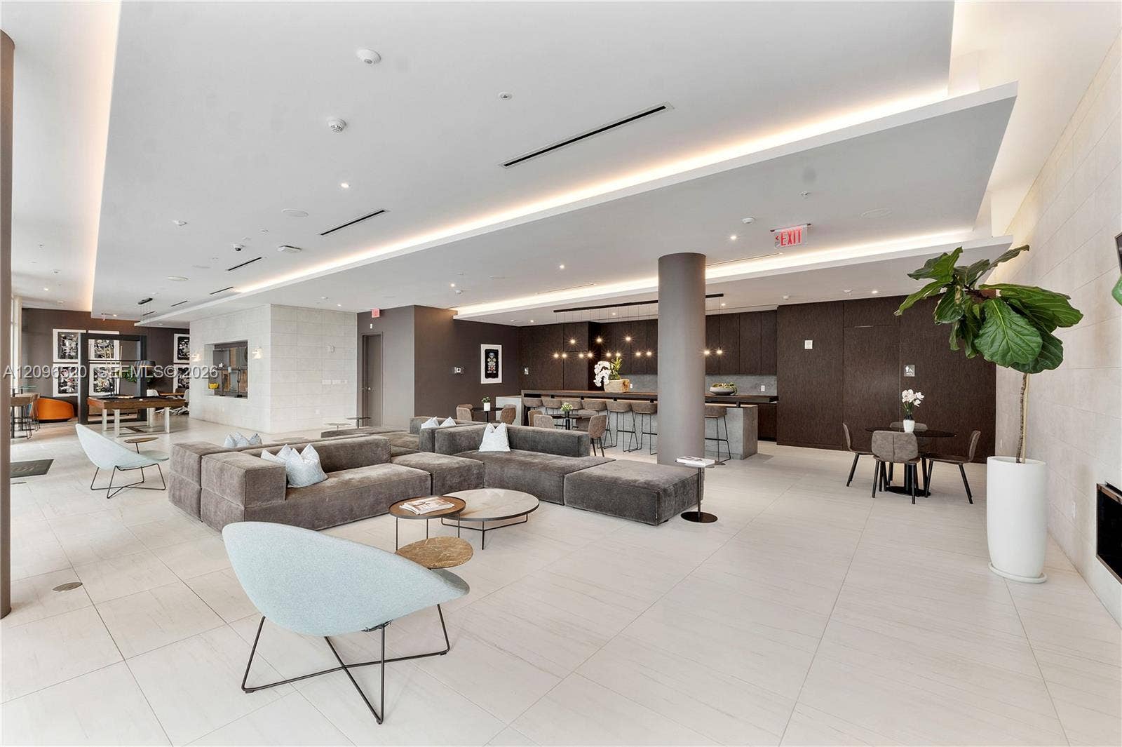 Open-concept interior featuring large-format tile flooring, recessed cove lighting, and a neutral color palette