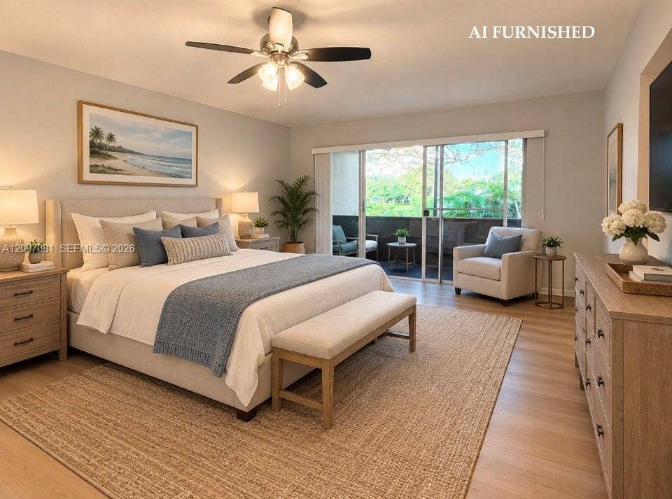 3271 Coral Springs Drive, #2, Coral Springs, Coral Springs, FL 33065 Neutral-toned interior space featuring light wood-finish flooring, a ceiling fan with integrated lighting, and a large sliding glass door providing access to a private balcony