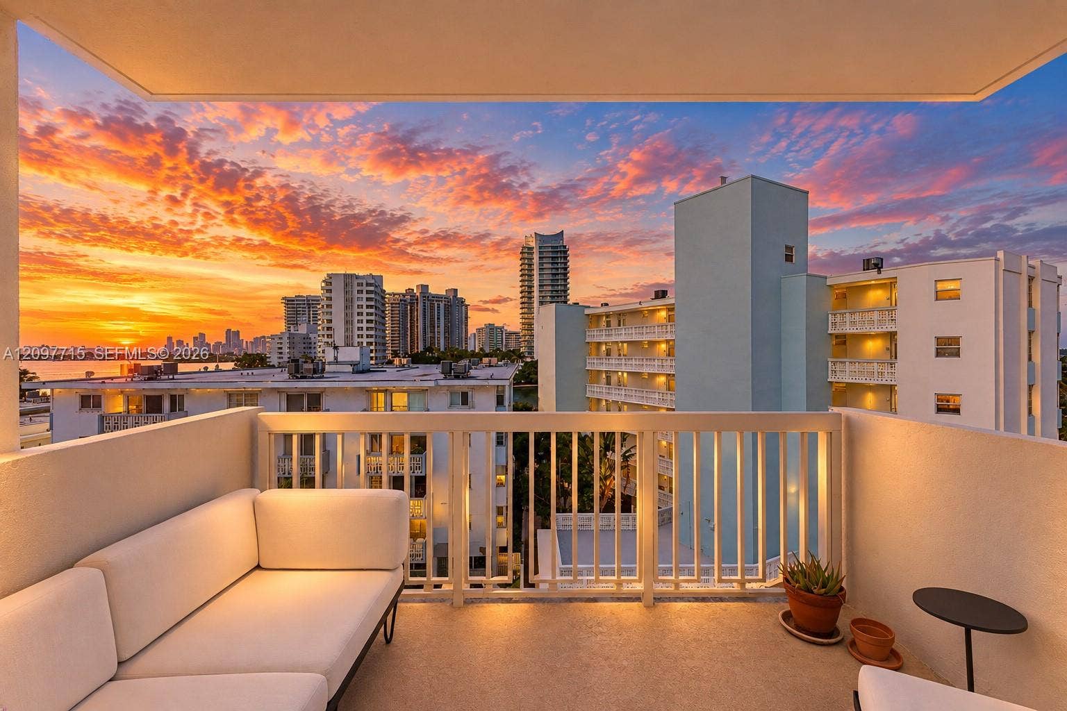 Outdoor balcony with a railing and urban skyline backdrop