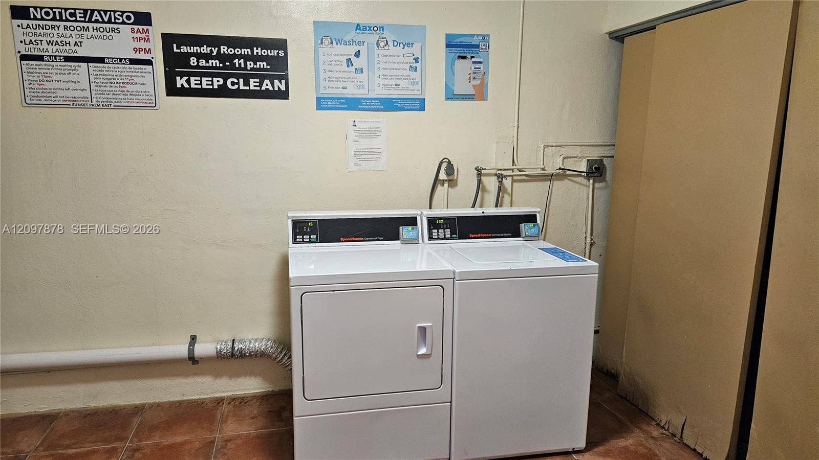 9477 SW 76th Street, #O2, Miami, Miami, FL 33173 Laundry area featuring side-by-side coin-operated appliances and tiled flooring