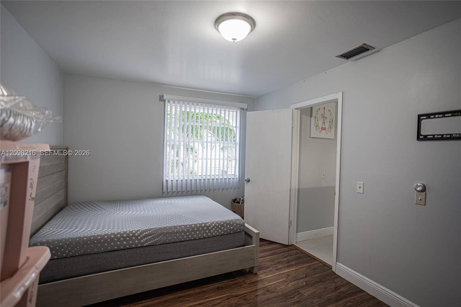 Additional bedroom with a garden facing window and closet space.