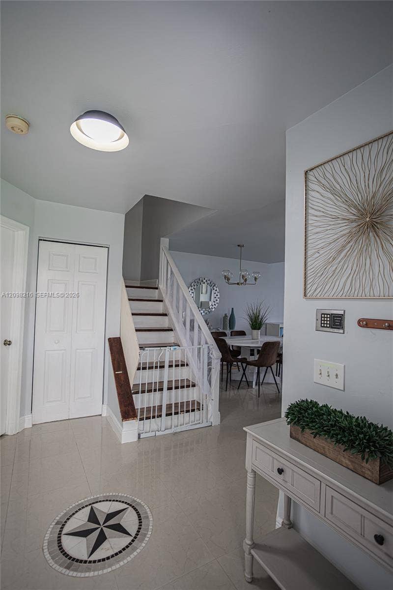 Staircase leading to the second level, with clean lines and a bright hallway.