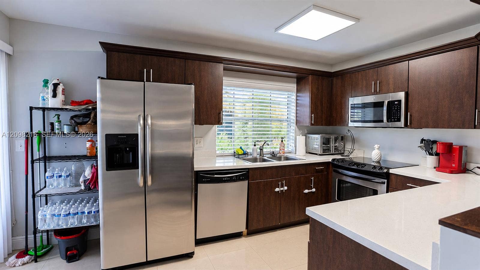 Bright kitchen with a window over the sink and plenty of counter and cabinet space.