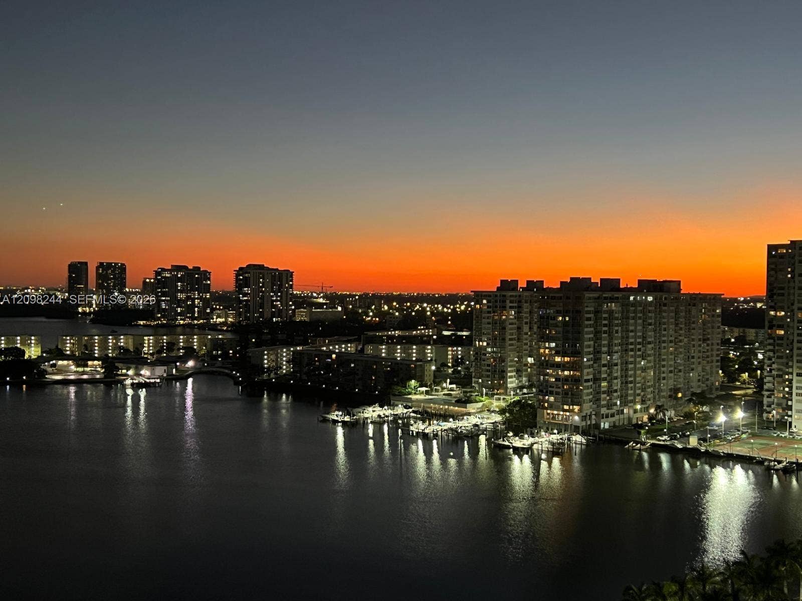 2851 NE 183rd Street, #2110E, Aventura, Aventura, FL 33160 Panoramic water and urban skyline backdrop featuring high-rise architecture, a marina, and bridge infrastructure