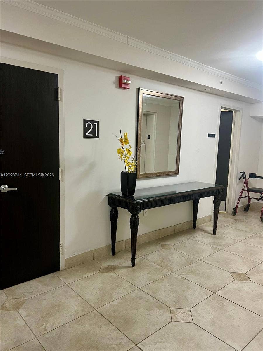 2851 NE 183rd Street, #2110E, Aventura, Aventura, FL 33160 Common area featuring large-format ceramic tile flooring and a wall-mounted fire safety alarm