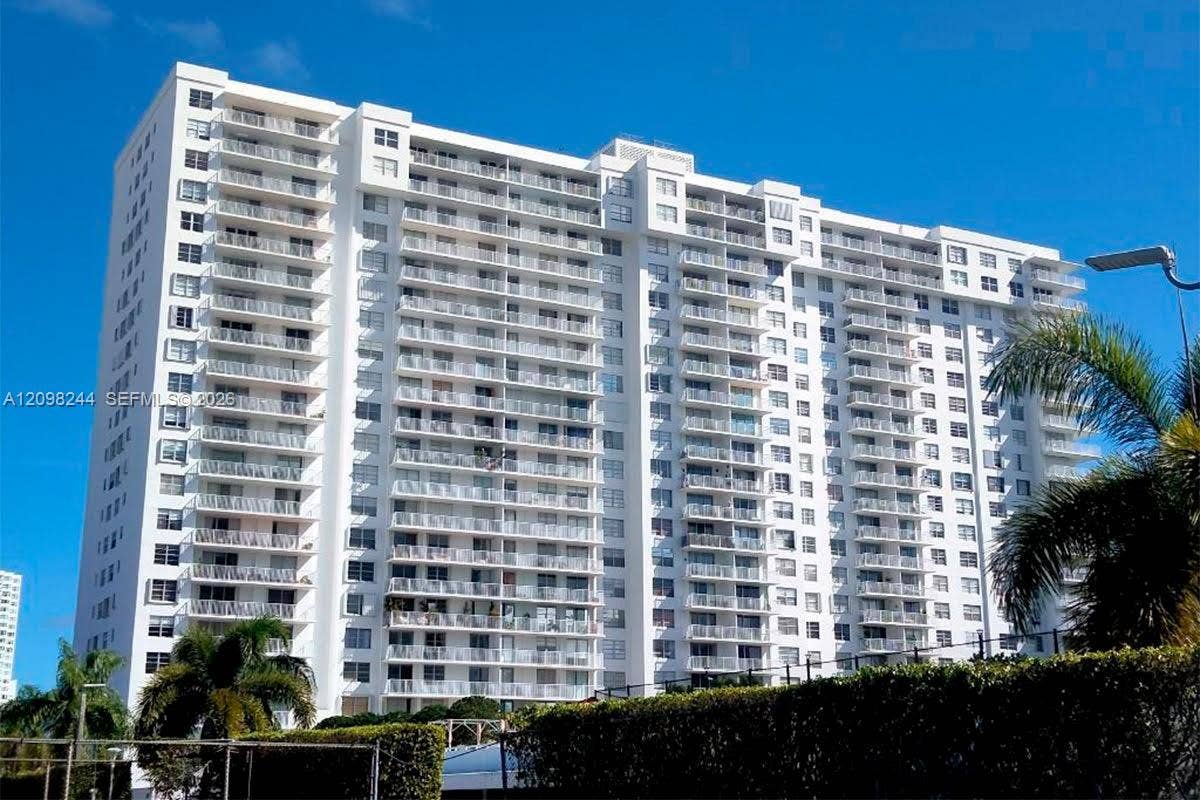 2851 NE 183rd Street, #2110E, Aventura, Aventura, FL 33160 High-rise residential exterior featuring a white facade, uniform horizontal balcony tiers, and metal railings