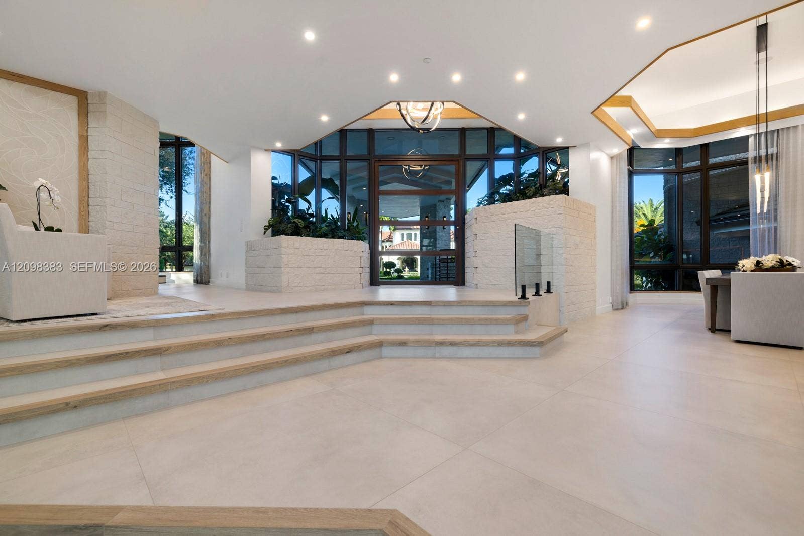 Grand entrance at 2965 Surrey Lane, Weston FL, featuring a 3-car garage and expansive driveway in Windmill Ranch Estates.