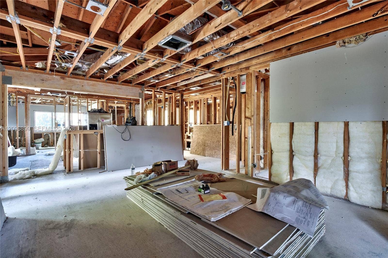 1176 SW 4th Street, Boca Raton, FL 33486 Open-concept structural layout featuring exposed timber framing, concrete flooring, and insulated wall panels