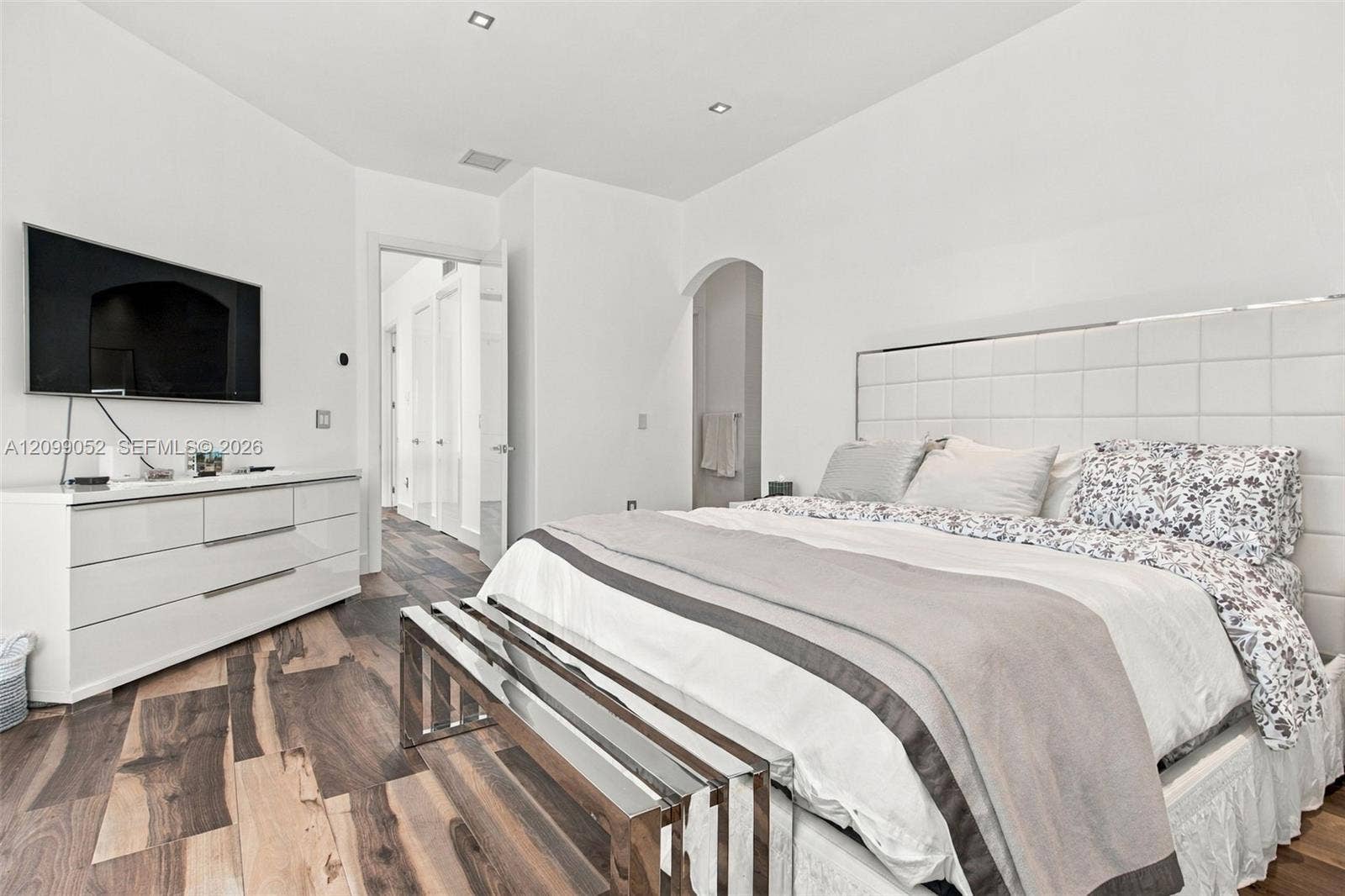 1516 Breakwater Terrace, Hollywood, FL 33019 Room interior featuring wood-finish flooring, recessed lighting, and an arched doorway