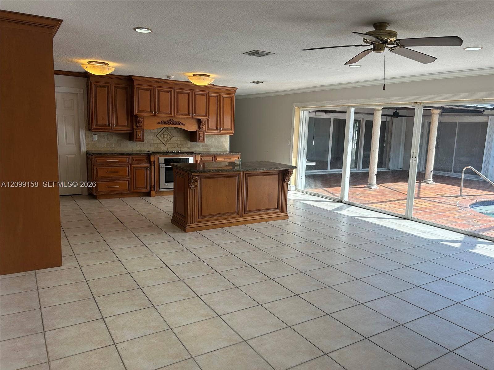1490 Lenape Drive, Miami Springs, FL 33166 Walk-in shower featuring tiled walls with a mosaic accent border and stainless steel grab bars