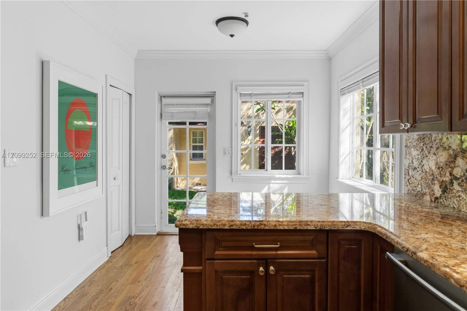 1461 Certosa Avenue, Coral Gables, FL 33146 Kitchen offers space for breakfast nook and convenient laundry closet