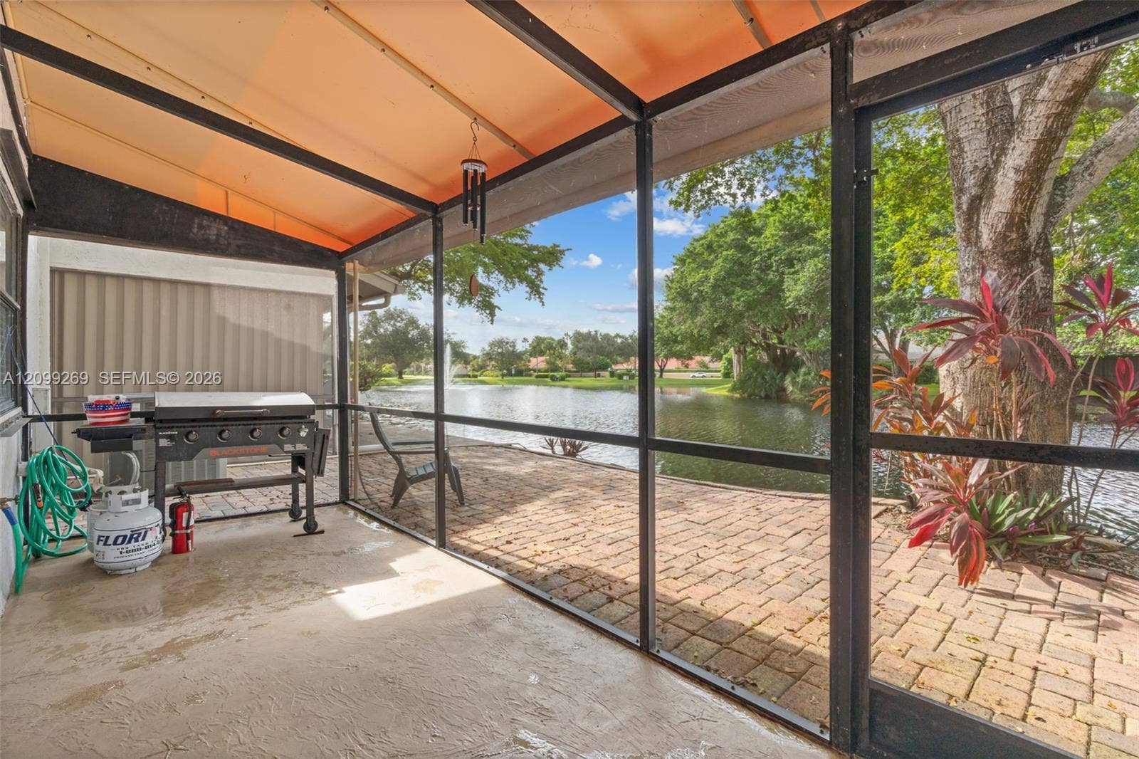 3329 Deer Creek Lake Shore Drive, Deerfield Beach, FL 33442 Patio w/ brand new awning