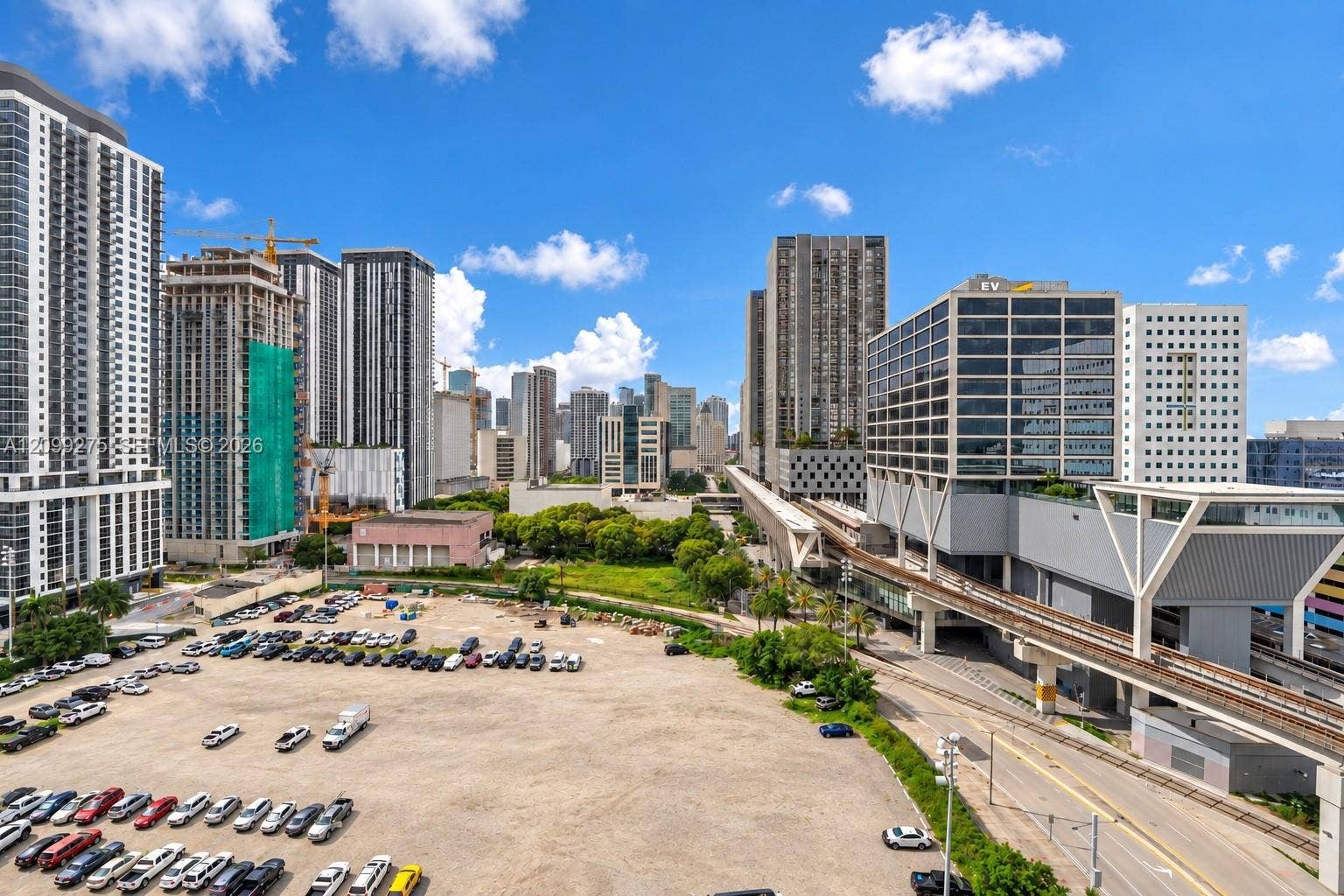 800 N Miami Avenue, #E-902, Miami, Miami, FL 33136 Large open parking area with ample space for multiple vehicles, conveniently located near high-rise buildings, commercial properties, and public transportation.