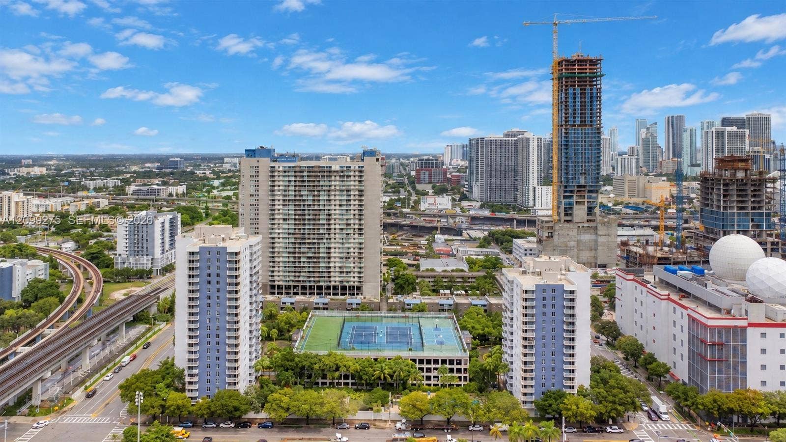 800 N Miami Avenue, #E-902, Miami, Miami, FL 33136 Panoramic skyline views showcasing Miamis vibrant urban landscape, with high-rise residences, ongoing new developments, and convenient access to public transportation.