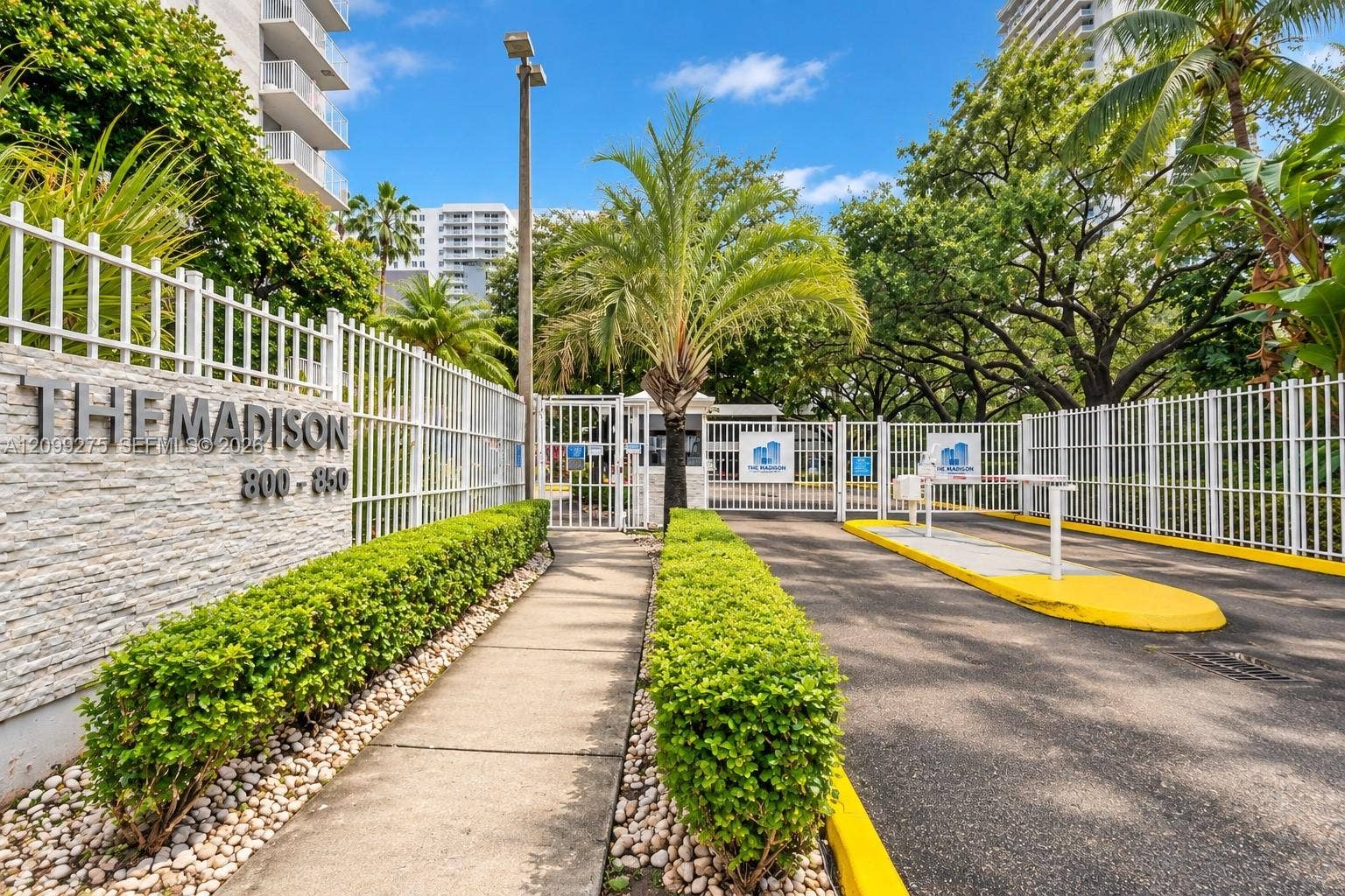800 N Miami Avenue, #E-902, Miami, Miami, FL 33136 Welcome to The Madison, featuring a gated entrance, controlled access, and beautifully landscaped grounds with lush tropical greenery.