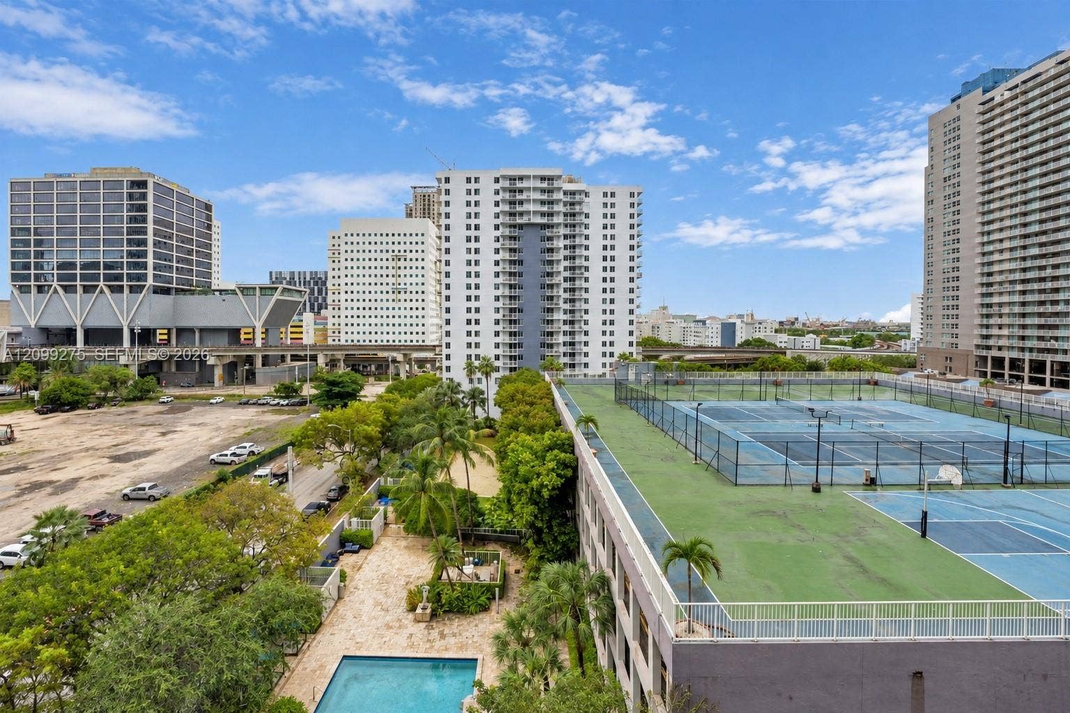800 N Miami Avenue, #E-902, Miami, Miami, FL 33136 Enjoy scenic views of the surrounding city skyline, waterfront, and community amenities, including the swimming pool and sports courts.
