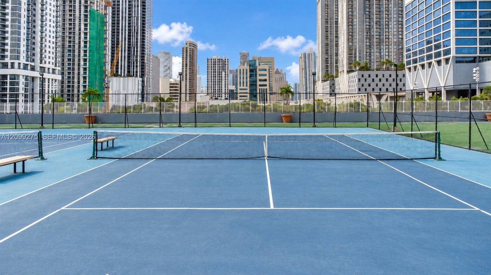 800 N Miami Avenue, #E-902, Miami, Miami, FL 33136 Tennis courts surrounded by Miamis impressive downtown skyline, offering residents a scenic outdoor space for recreation and an active lifestyle.