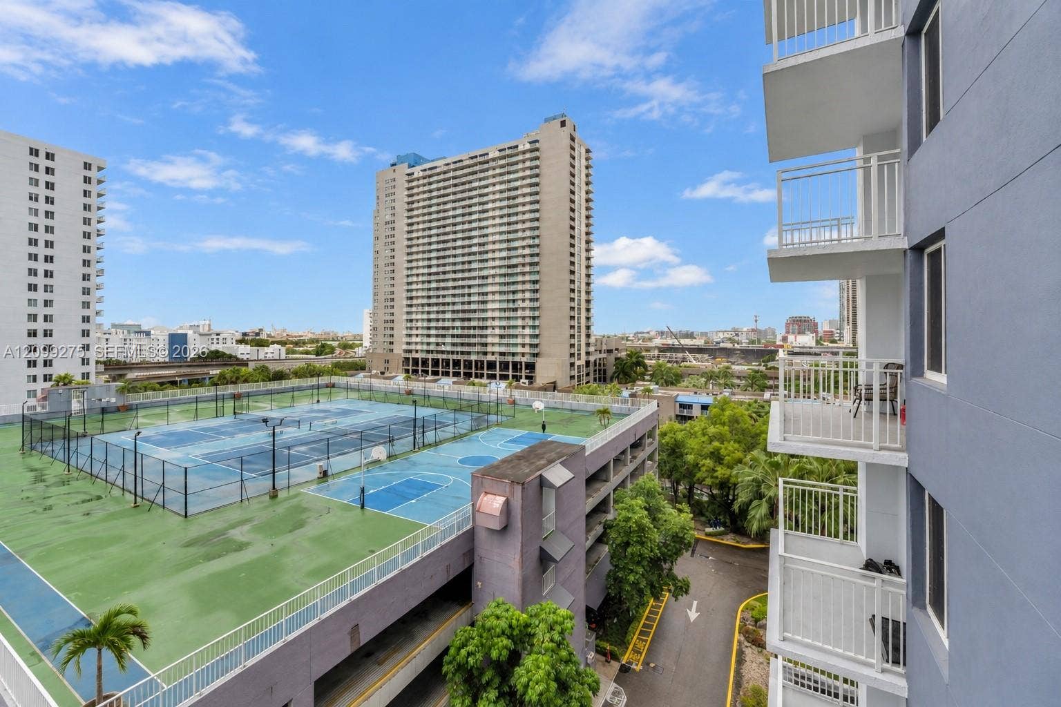 800 N Miami Avenue, #E-902, Miami, Miami, FL 33136 Enjoy expansive city views overlooking the communitys tennis and basketball courts, lush greenery, and surrounding high-rise buildings.