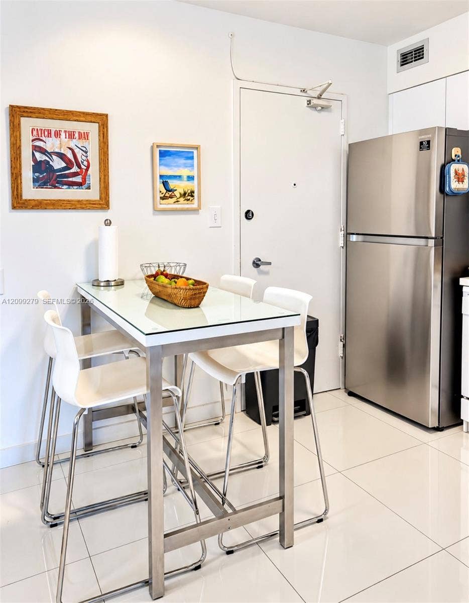 5151 Collins Avenue, #921, Miami Beach, Miami Beach, FL 33140 Stainless steel refrigerator and high-gloss tile flooring