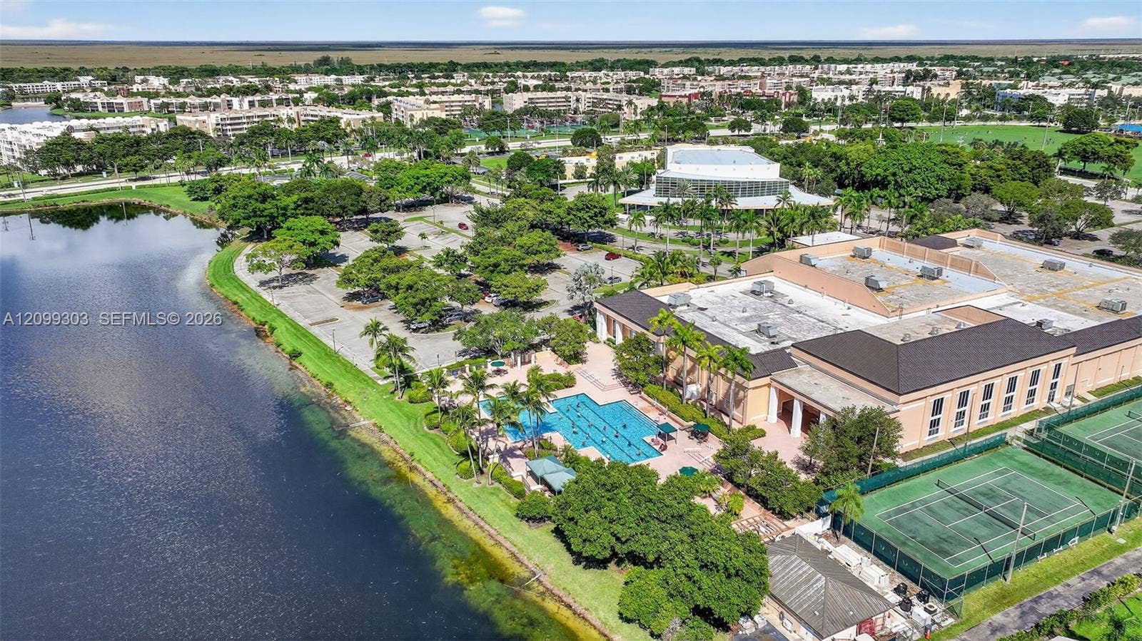 7917 Exeter Boulevard E, #101, Tamarac, FL 33321 Kings Point Clubhouse, The Palace Theater, Tennis/Pickle Ball Courts, and Pool Area