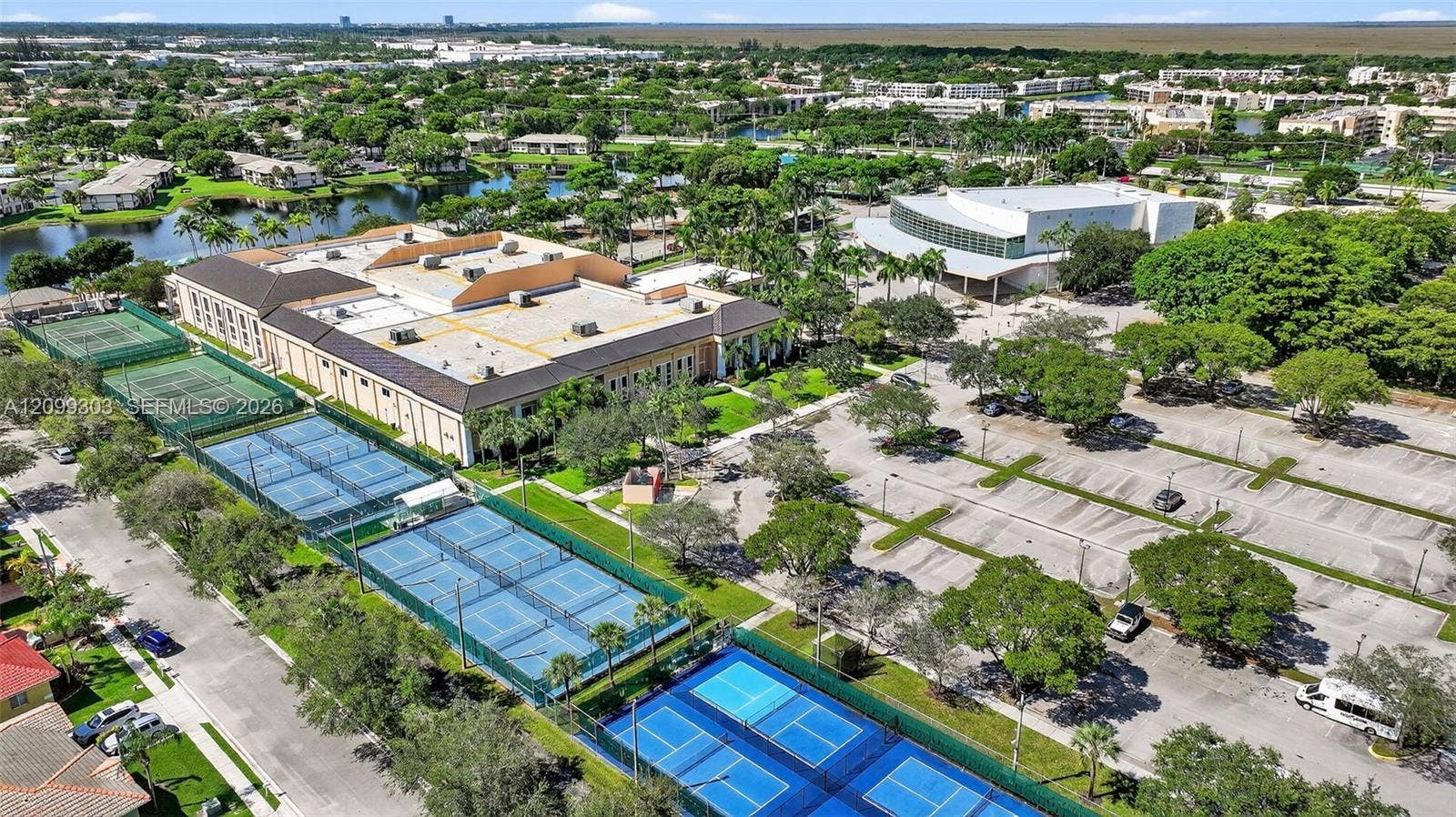 7917 Exeter Boulevard E, #101, Tamarac, FL 33321 Kings Point Clubhouse, The Palace Theater, Tennis/Pickle Ball Courts, and Pool Area