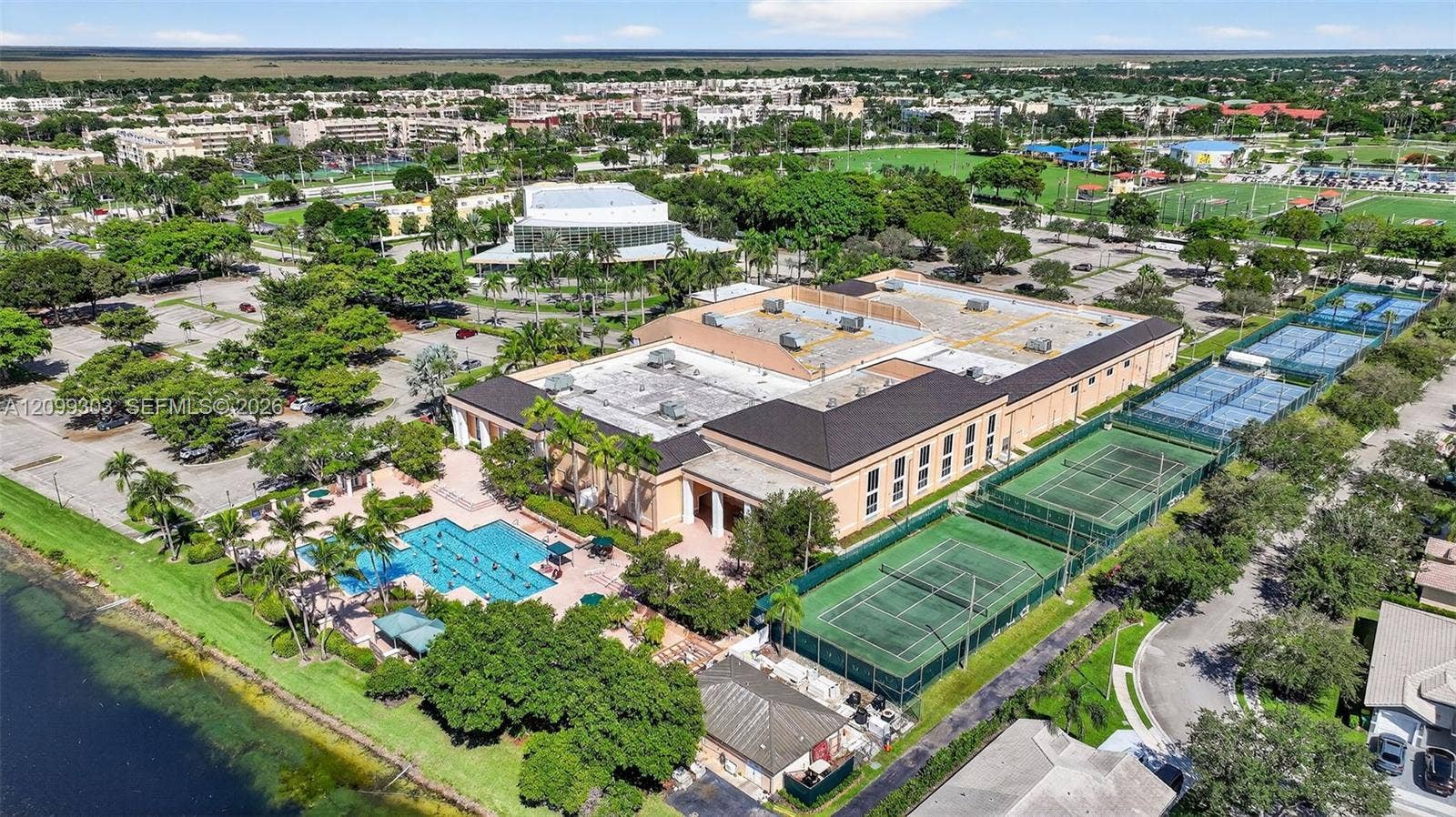 7917 Exeter Boulevard E, #101, Tamarac, FL 33321 Kings Point Clubhouse, The Palace Theater, Tennis/Pickle Ball Courts, and Pool Area