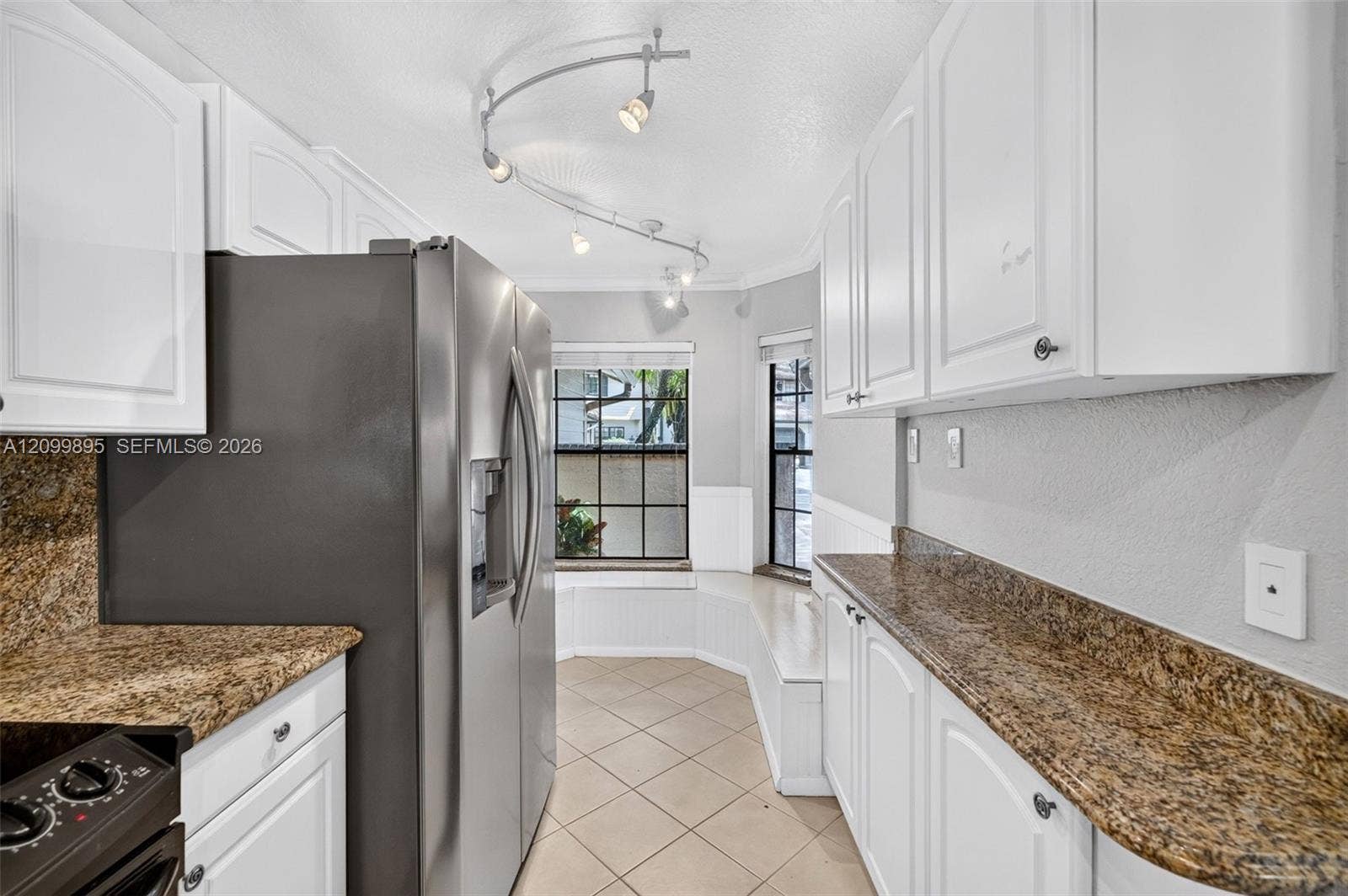 9012 Vineyard Lake Drive, Plantation, FL 33324 Well-equipped kitchen featuring ample cabinetry, a pantry and a convenient breakfast area.