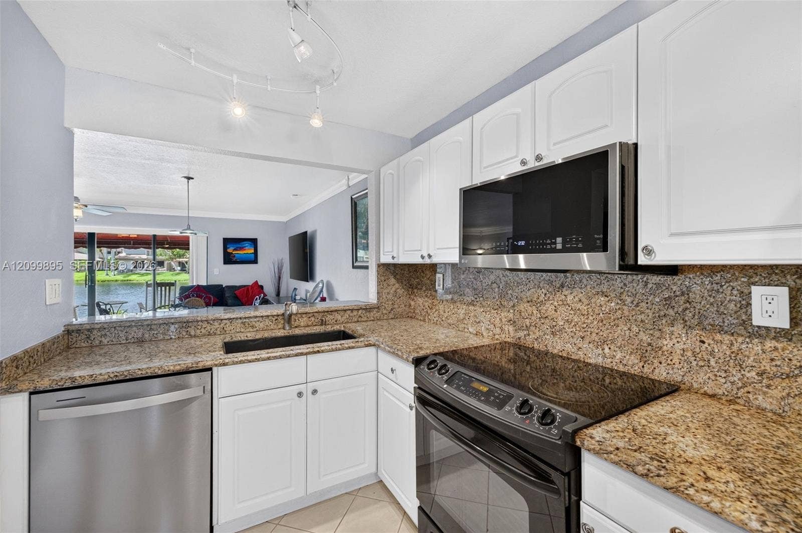 9012 Vineyard Lake Drive, Plantation, FL 33324 Well-equipped kitchen featuring ample cabinetry, a pantry and a convenient breakfast area.