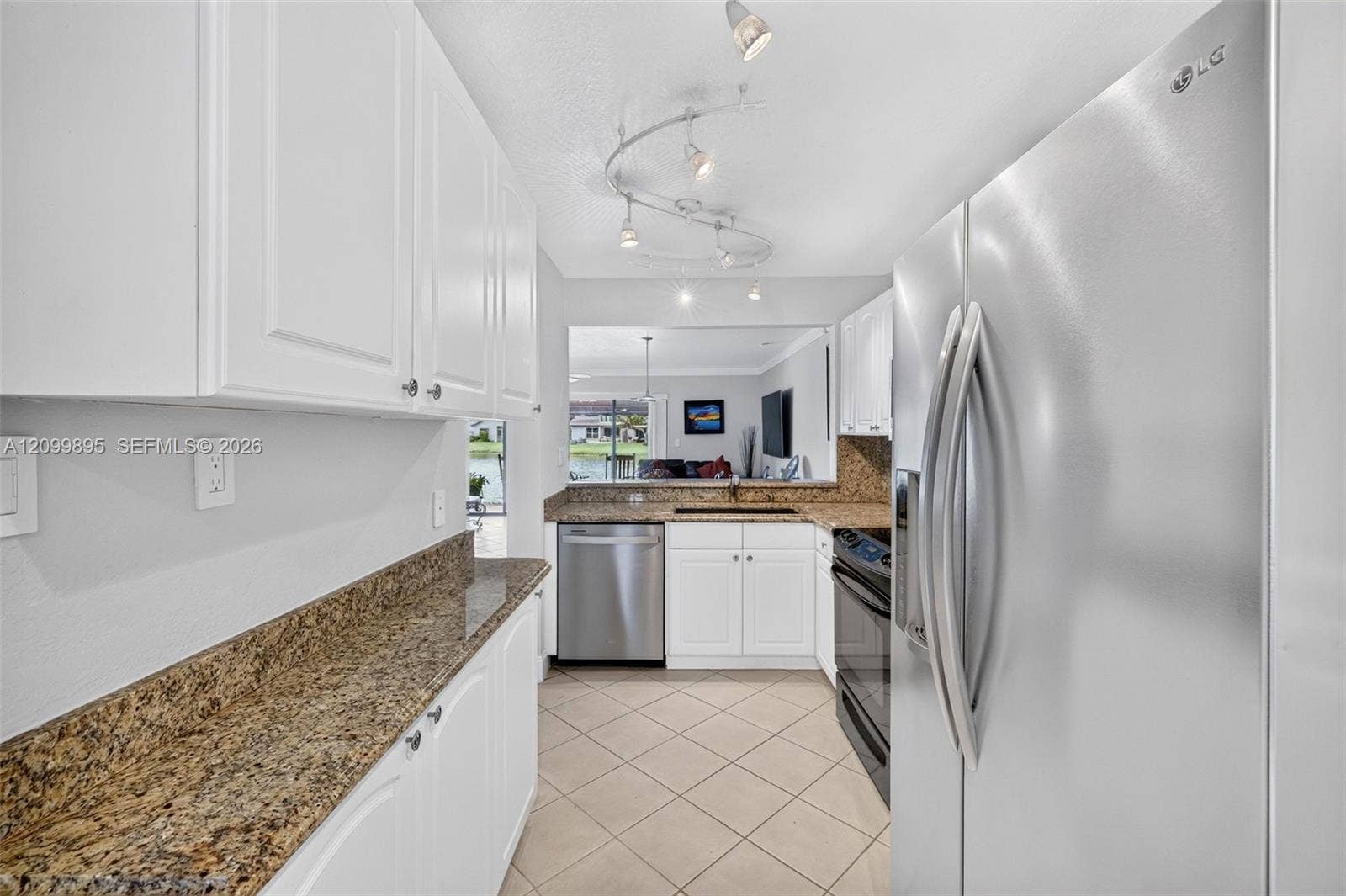 9012 Vineyard Lake Drive, Plantation, FL 33324 Well-equipped kitchen featuring ample cabinetry, a pantry and a convenient breakfast area.